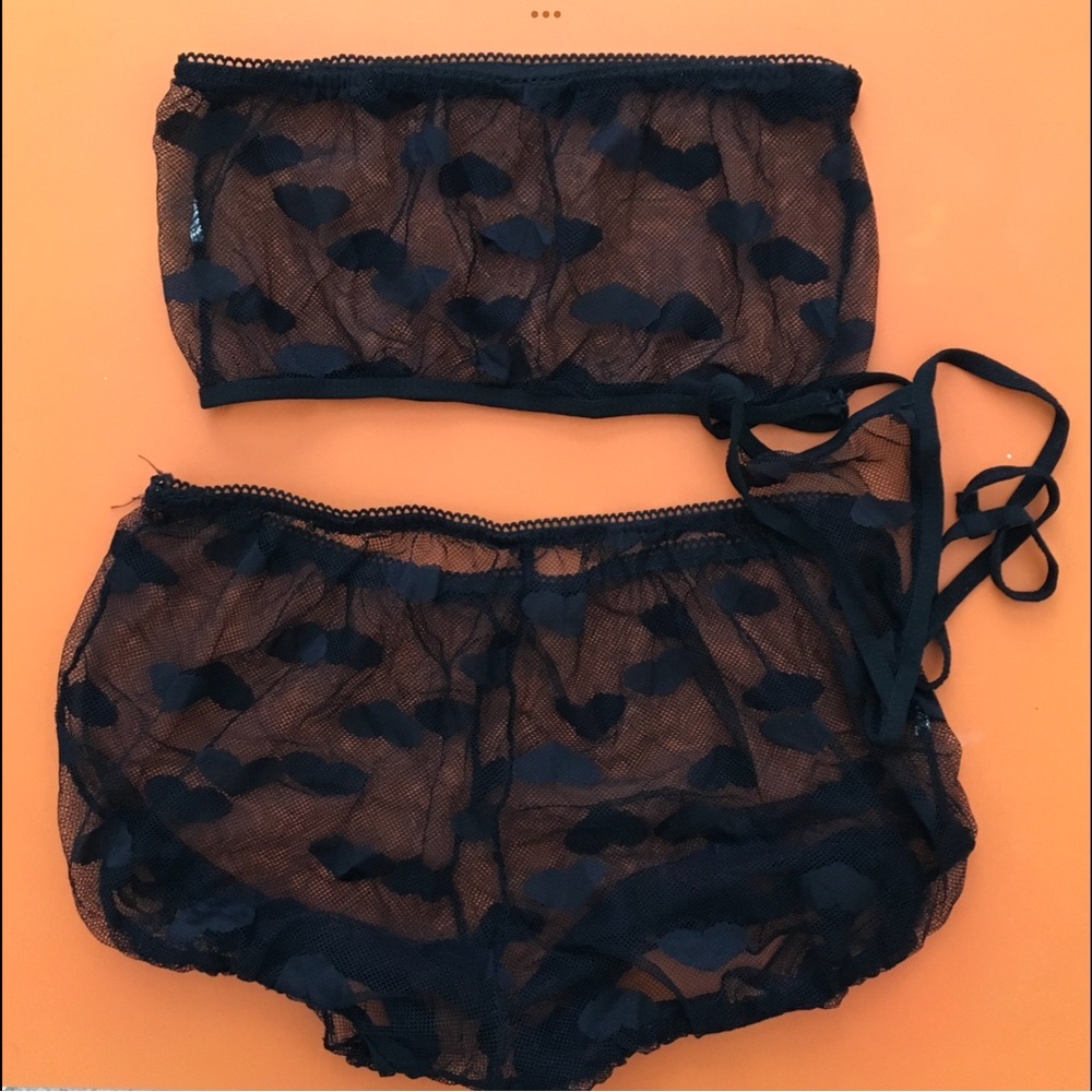 Black mesh lingerie set with hearts.